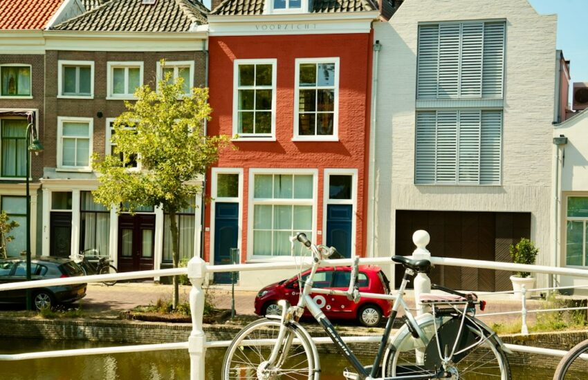 Bicycle on a bridge overlooking colorful canal houses